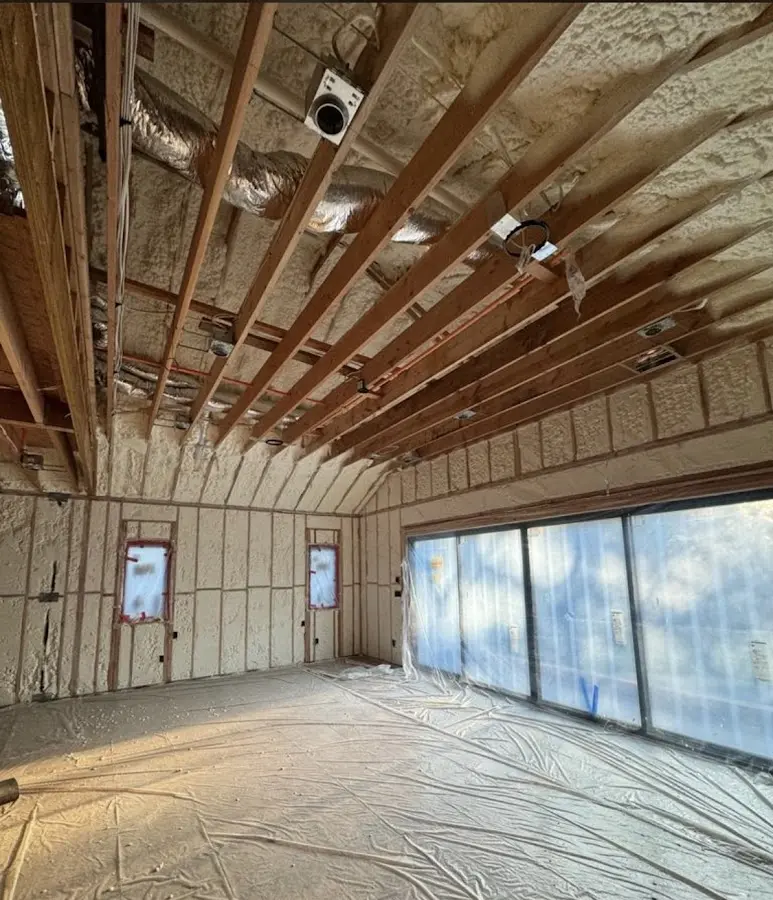 Interior walls and ceiling insulated with spray foam during new construction in Scriba